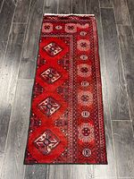 Full view of handmade Turkman wool rug showing entire pattern and size