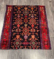 Full view of rug flat showing entire pattern and borders