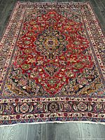 Full view of Persian rug showing overall design and dimensions