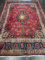 Full view of Persian rug showing overall design and size