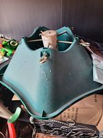 Top view of green plastic Christmas tree stand with wooden plug inserted