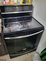 Front view of Frigidaire range, cooktop and control panel visible