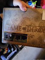 Front view of Game of Thrones collector boxed set showing logo and noted packaging wear