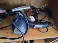 Hair dryer showing body, cord, plug and condition