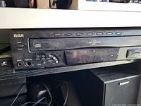 Front view of RCA 5-disc CD changer showing controls, display and branding