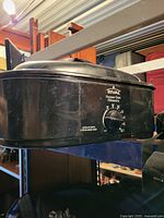 Front view of Rival roaster oven showing brand logo and control dial