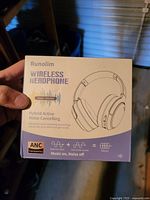 Front of sealed retail box for Runolim WH301A wireless headphones