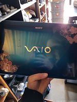 Top lid showing Sony VAIO logo and floral decals