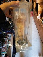 Packaged tall novelty beer tower glass showing "xl glass" branding and "holds 5 beers!" text