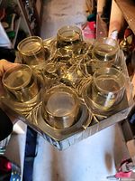 Hexagonal tray with six shot glasses and center cup showing etched leaf pattern
