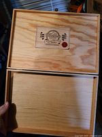 Lid open showing interior compartment and Walker's label underside