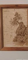 Full view of framed pyrography on birch bark