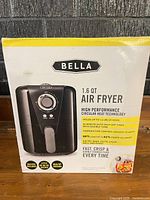Front of sealed Bella air fryer box showing product image and specifications