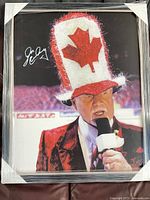 Front view of framed Don Cherry photographic print showing image, signature, frame and shrink wrap