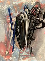 Bag filled with assorted plastic hangers