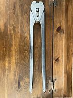 Full length view of crimper/sealer showing both handles and head