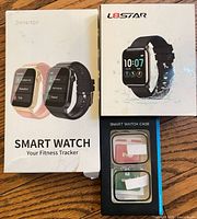Front view of Donerton smartwatch box, L8STAR smartwatch box, and face cover package