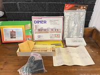 Overall lot showing boxed kits, sprue pack, track, wiring and instructions