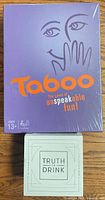 Front view sealed Taboo box and sealed Truth or Drink box