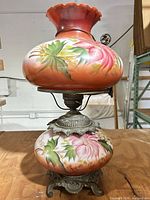 Full view of hand-painted two-globe hurricane lamp