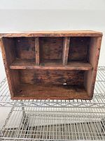 Front view showing interior dividers and shelf