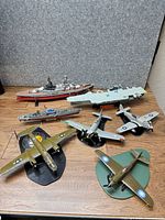 Group shot of all warship and aircraft models on tabletop