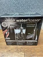Front of sealed Waterpik Ultra & Cordless Plus water flosser combo pack box