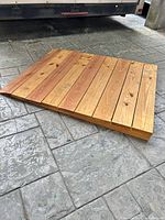 Top view of wooden ramp showing full surface of planks and wedge shape
