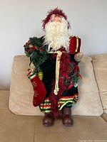 Front view of 13" Santa figure on sofa