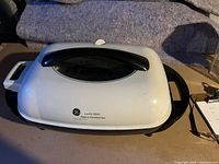 Top view of GE electric skillet with lid attached