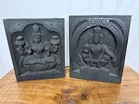 Front view of both carved wood panels