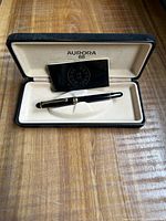 Aurora 88 pen inside open presentation box with booklet