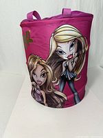 Full view of Bratz pink cylindrical hamper showing graphics and handles