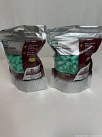 Front view of two sealed packs showing brand, 80 pairs, ear plugs visible