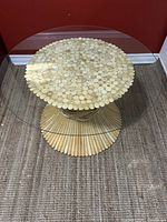 Full view of round glass-topped bamboo rattan coffee table