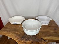 All three CorningWare bakers displayed on table