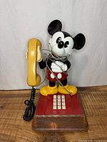 Front view of Mickey Mouse telephone showing figure, keypad and handset