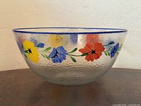 Full side view of bowl showing floral band and texture