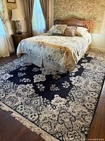 Rug shown under bed, full view