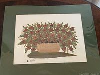 Front view of framed dried flower collage showing bouquet in basket design