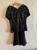 Full view of front of dress on hanger