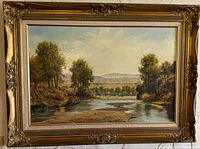 Full view of framed landscape painting