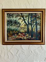 Full view of framed oil painting on wall