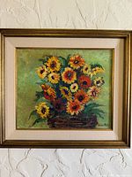 Framed oil painting of sunflowers, front view