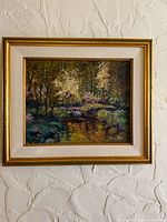 Full view of framed oil painting on wall