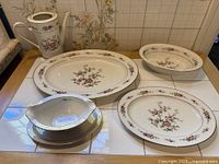 Group shot of Noritake Asian Song serving pieces