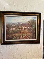 Front view of framed Tuscan countryside artwork