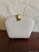 front view of white crocodile leather shoulder bag