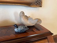Loon trinket box and ceramic bird planter displayed together