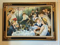 Full view of framed Renoir print on wall